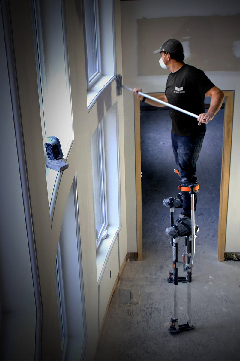 Drywall contractor on SurPro S1X magnesium Drywall Stilts